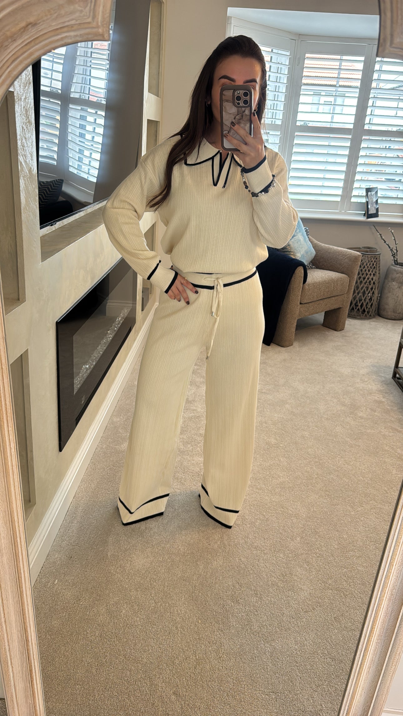 Cream two piece with black trim